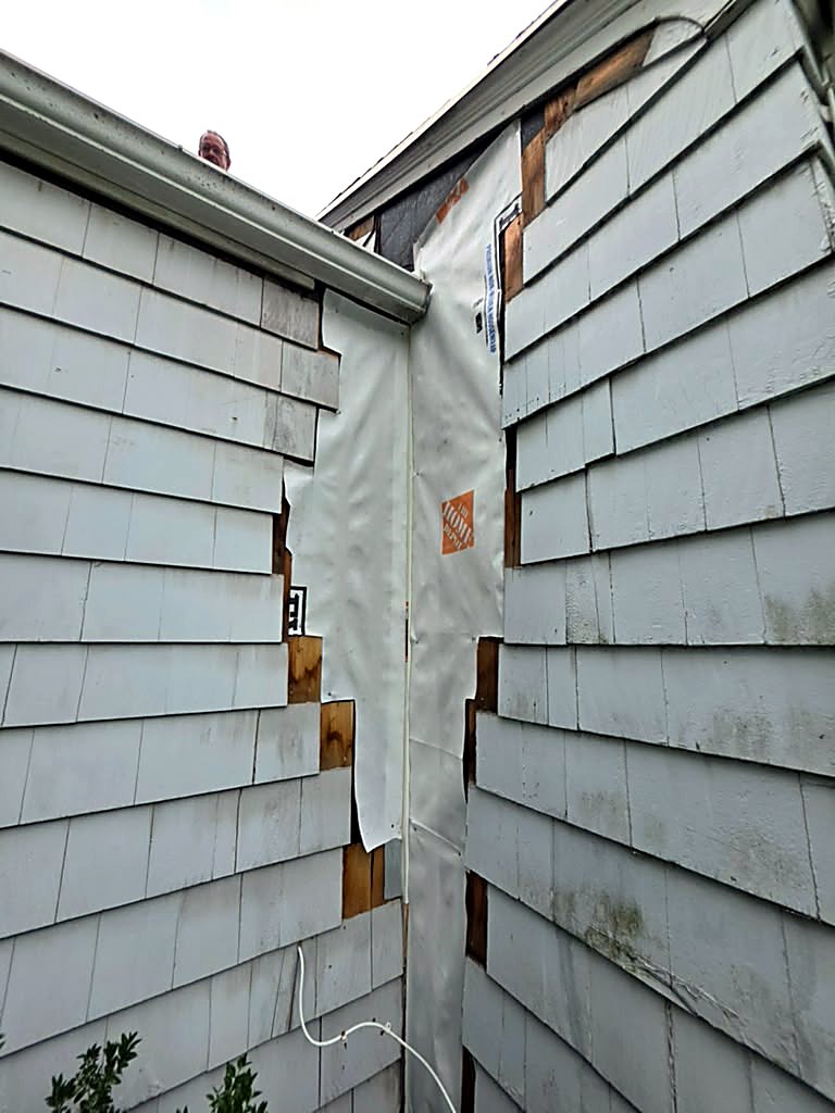During: new weather barrier installed over the sheathing on a Worcester, MA cape