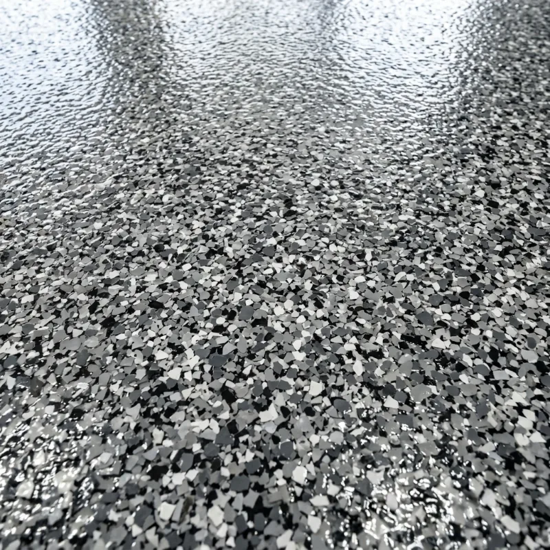 Design idea: close-up of grey and black flake epoxy floor coating